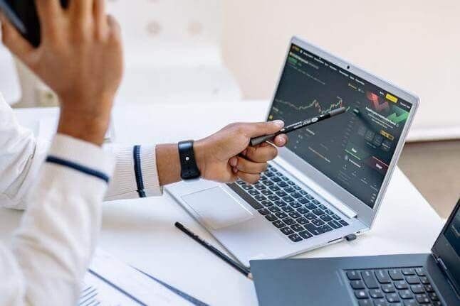 Bottom-Up vs Top-Down investment strategies analyzed on laptop